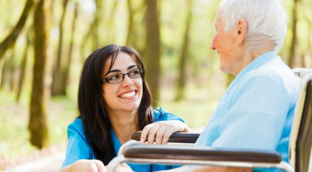 A picture of a Two Counties Carer with an elderly client | Web Design Surrey