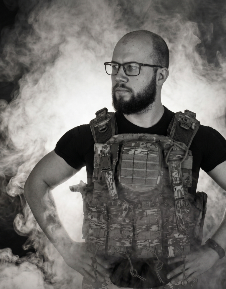 Gemini generated image of Josh Short, Thunderbolt's Creative Director, wearing a paintball vest and standing against a smokey background