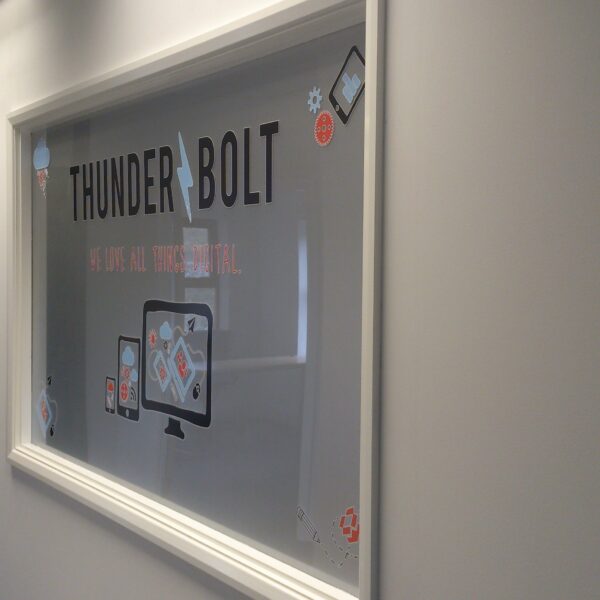 Thunderbolt branded window at our first office in Farnham