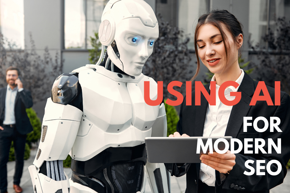 A woman and a smart robot looking at a tablet | Top SEO agency in Surrey