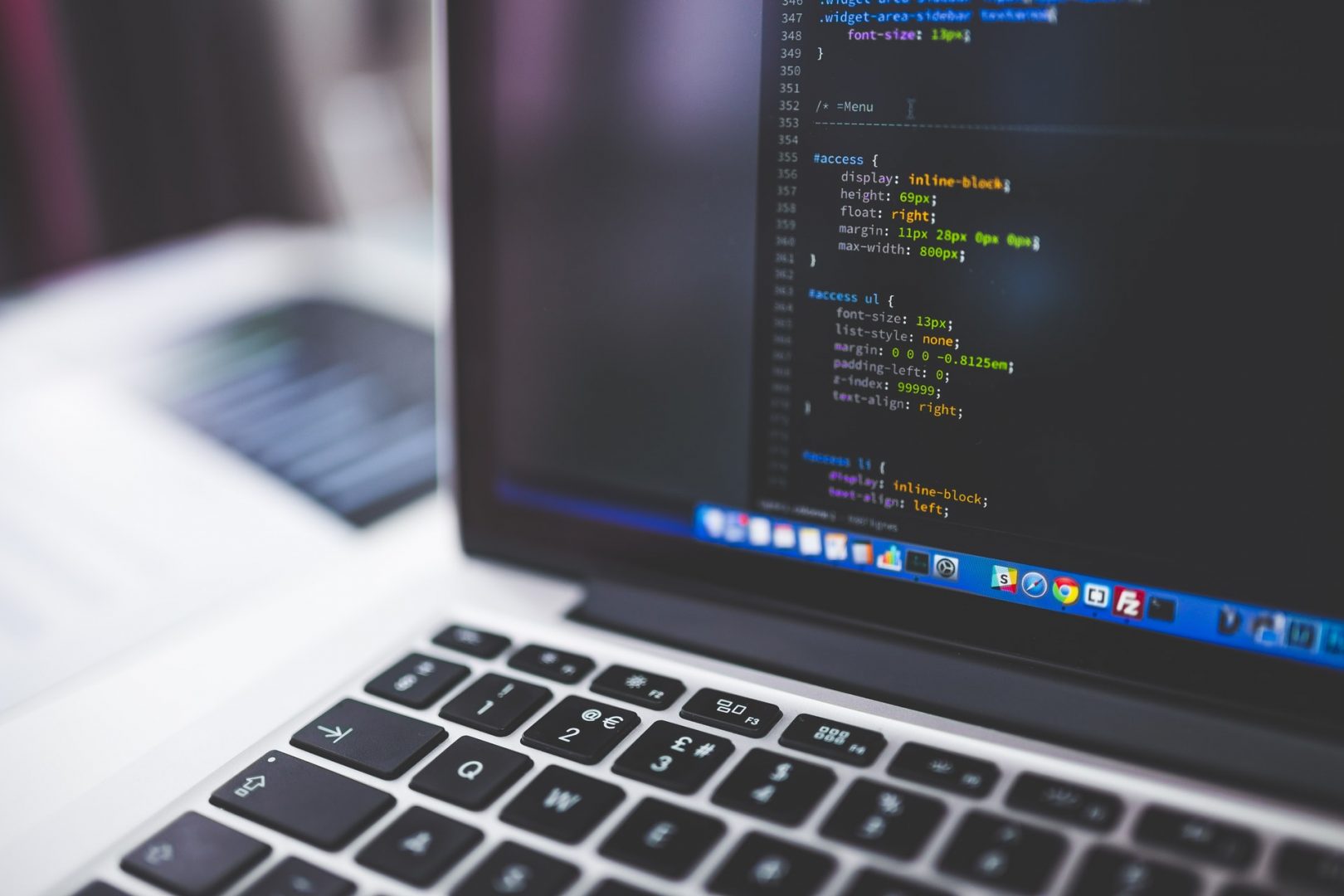 A laptop screen showing Laravel coding