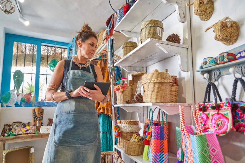 Woman updating her shop's Google Business Profile in store