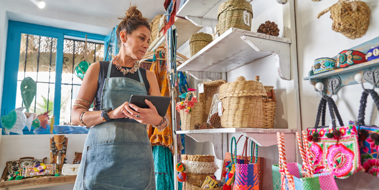 Woman updating her shop's Google Business Profile in store