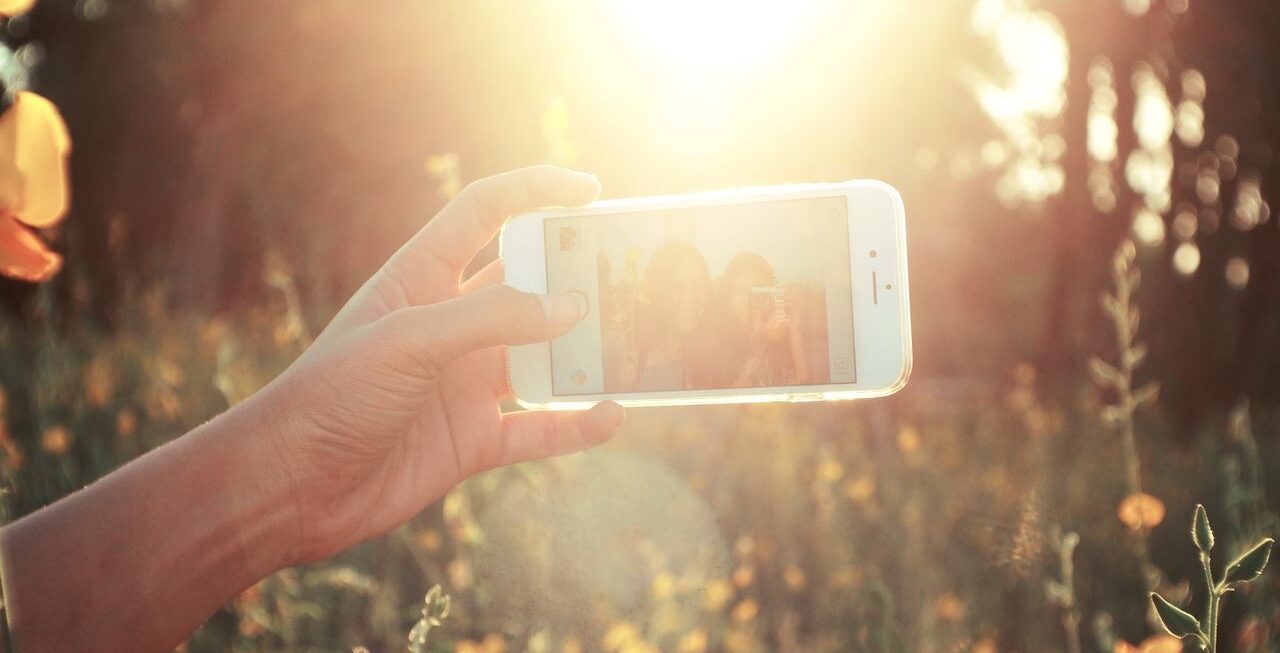 Person on Instagram in field | App Development Surrey