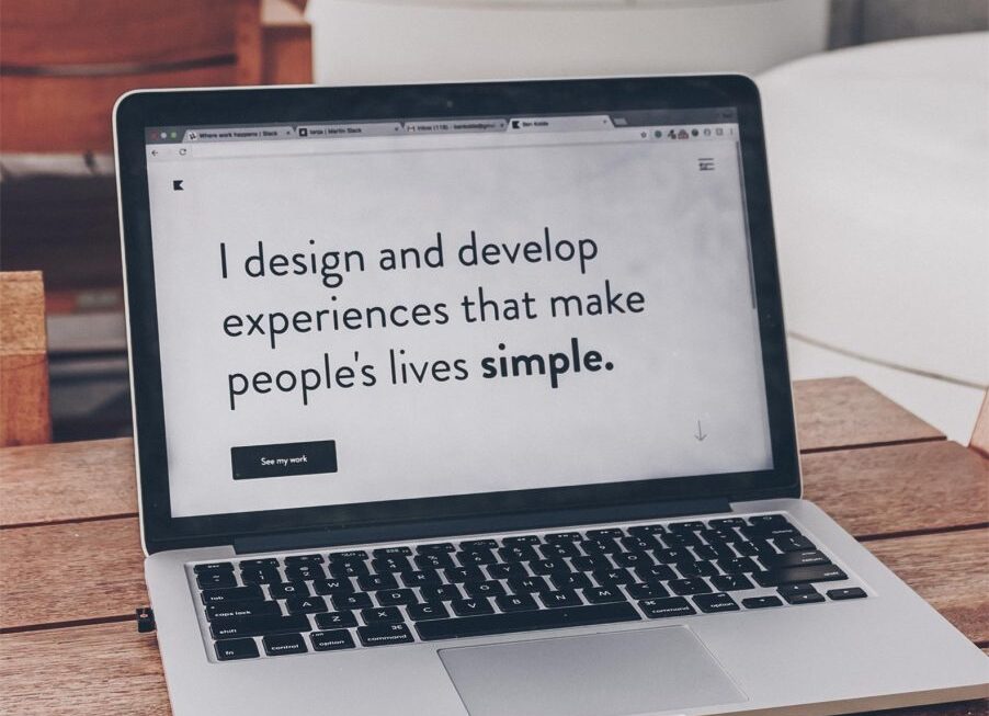 Macbook on desk web agency in Surrey