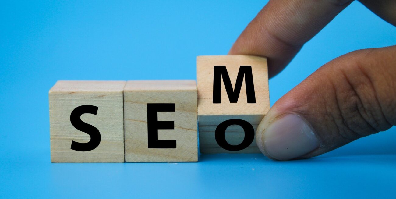 Wooden blocks that spell SEM, with the M being turned to reveal an O