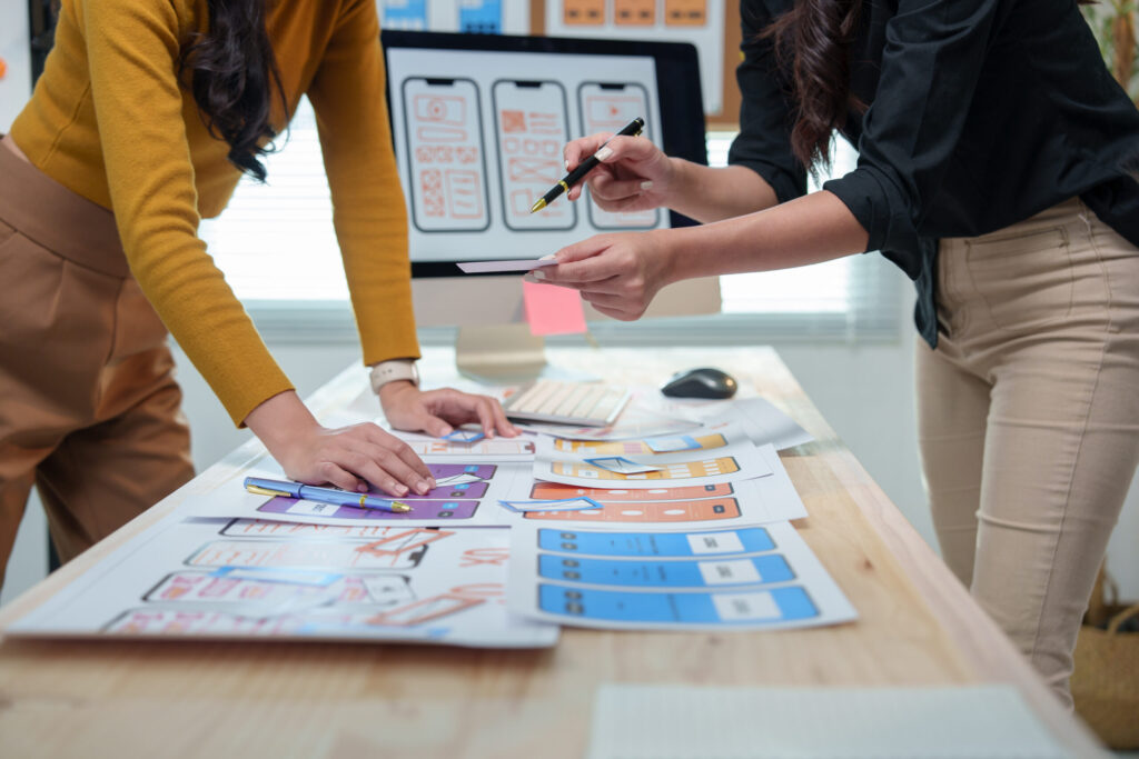 2 designers discussing website design for SEO