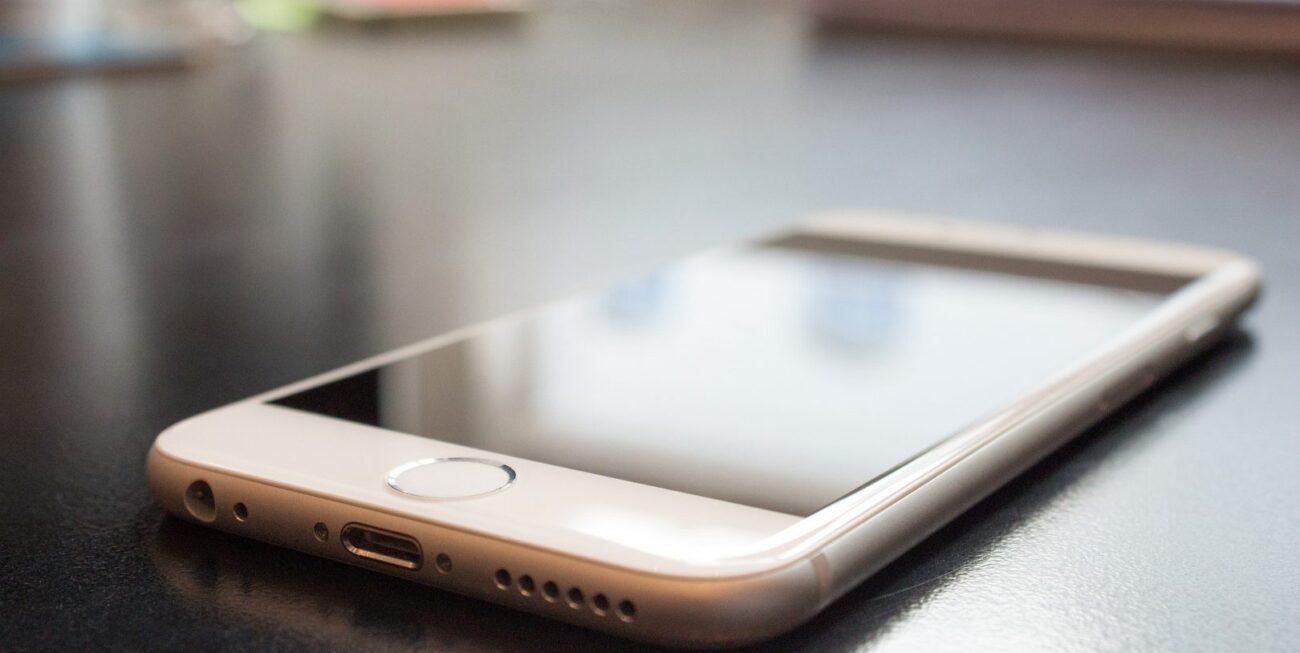 An iPhone lies on a table | Web Design Surrey