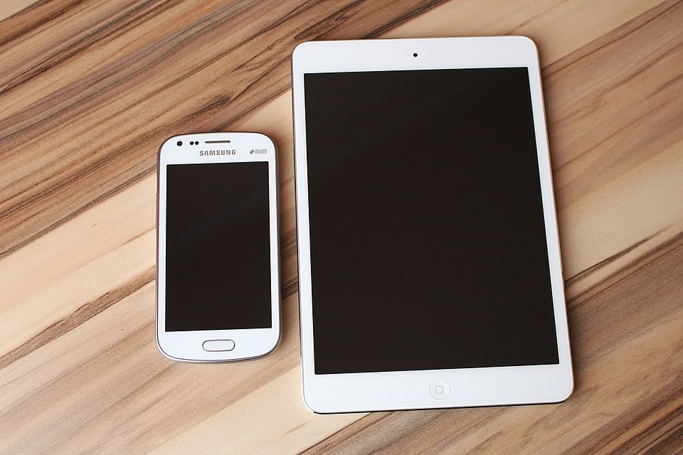 An image of a mobile phone next to a tablet | Web Design Surrey | Thunderbolt