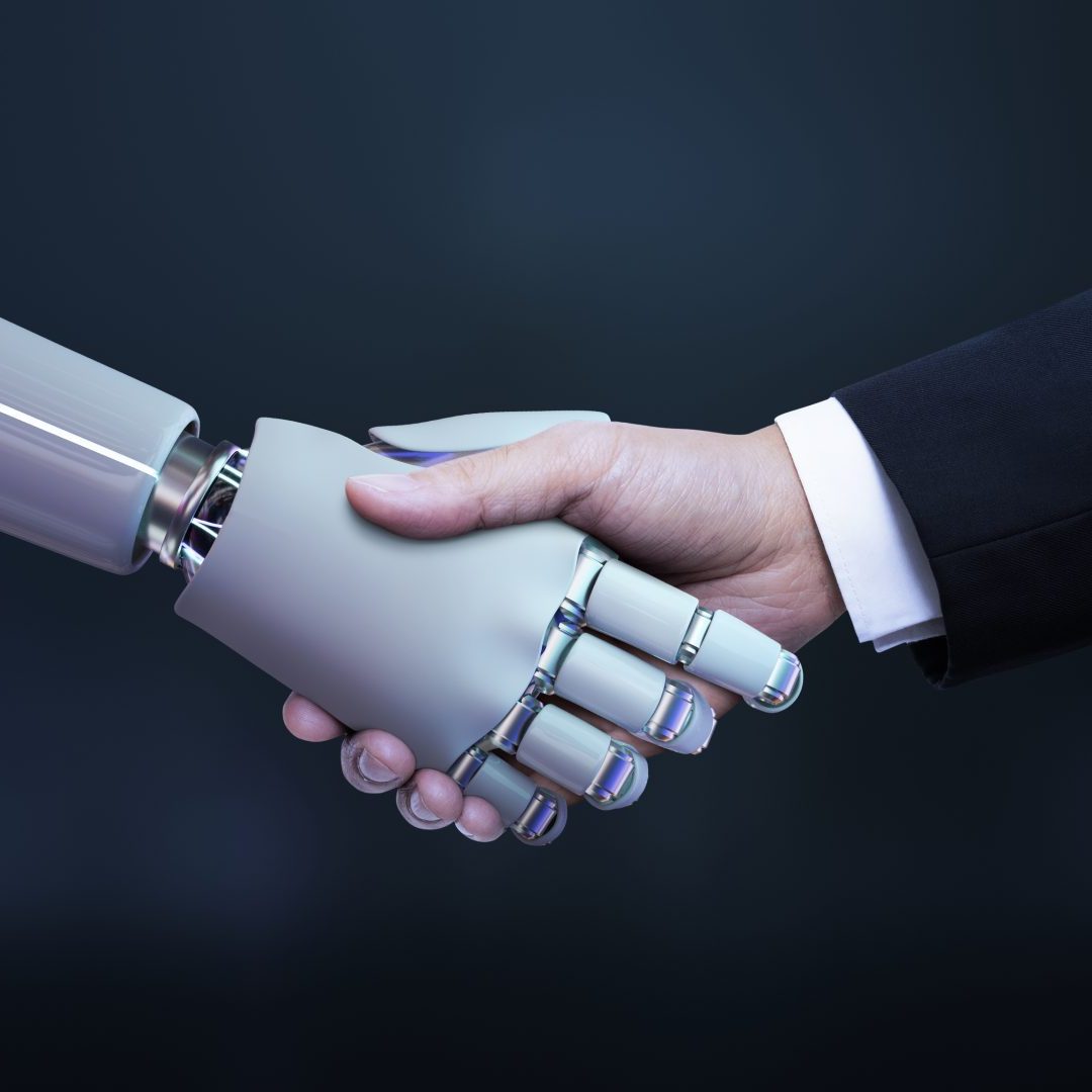 Robot shaking hands with business man wearinga suit