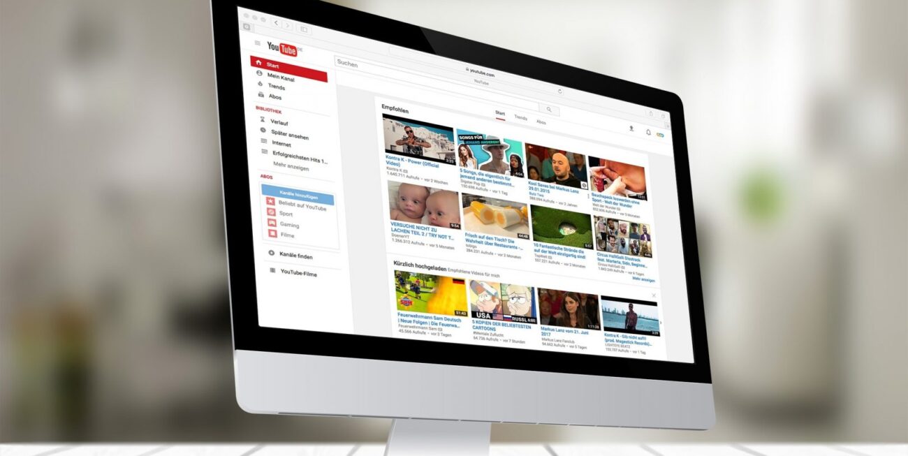 YouTube displayed on a computer screen at a company that specialises in social media in Surrey