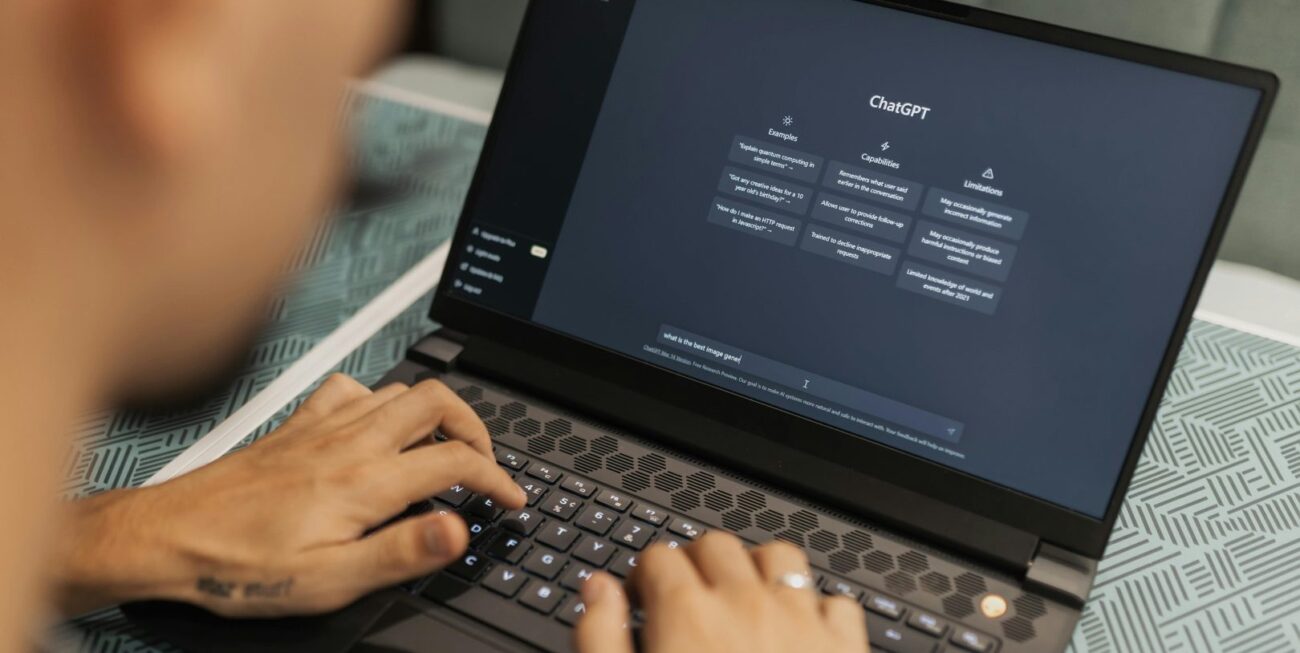 A man viewing ChatGPT on his laptop screen, about to use it for online marketing in Surrey