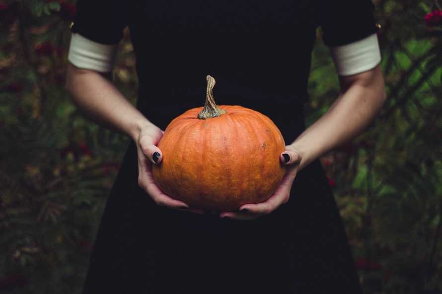 Halloween image of a person holding a pumpkin | Thunderbolt Digital