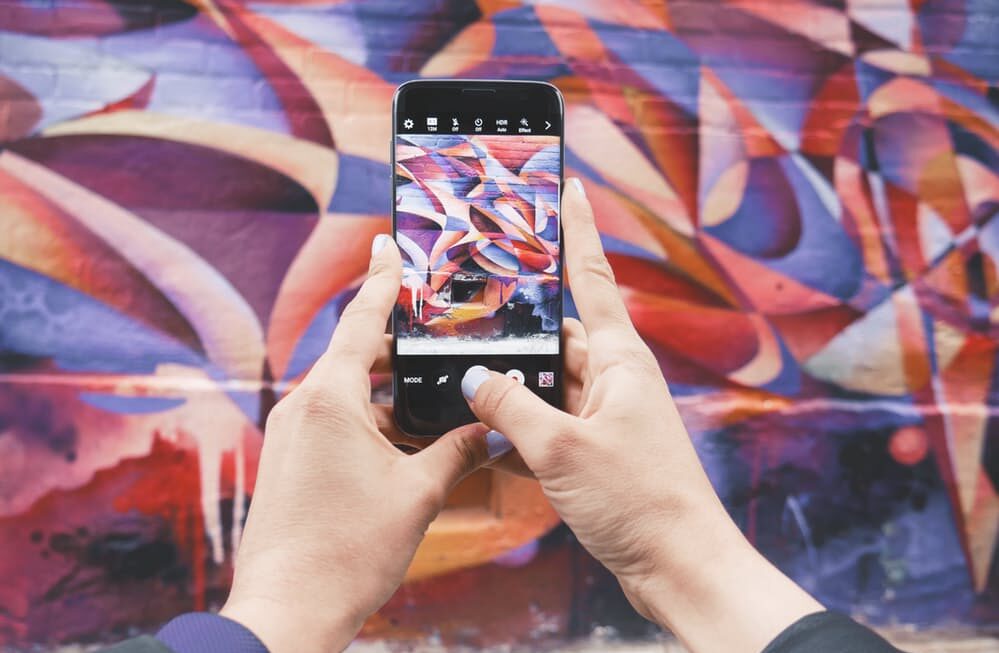 Someone taking a picture on a Samsung | SEO Surrey