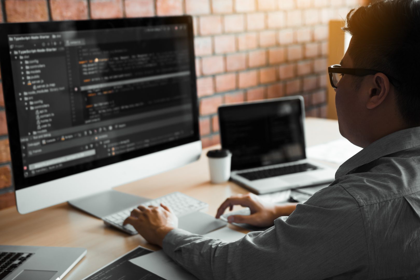 A developer coding at their desk