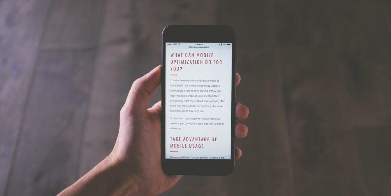 A website shown on a phone screen - one of the 2019 trends our web design agency in surrey expect to see next year.