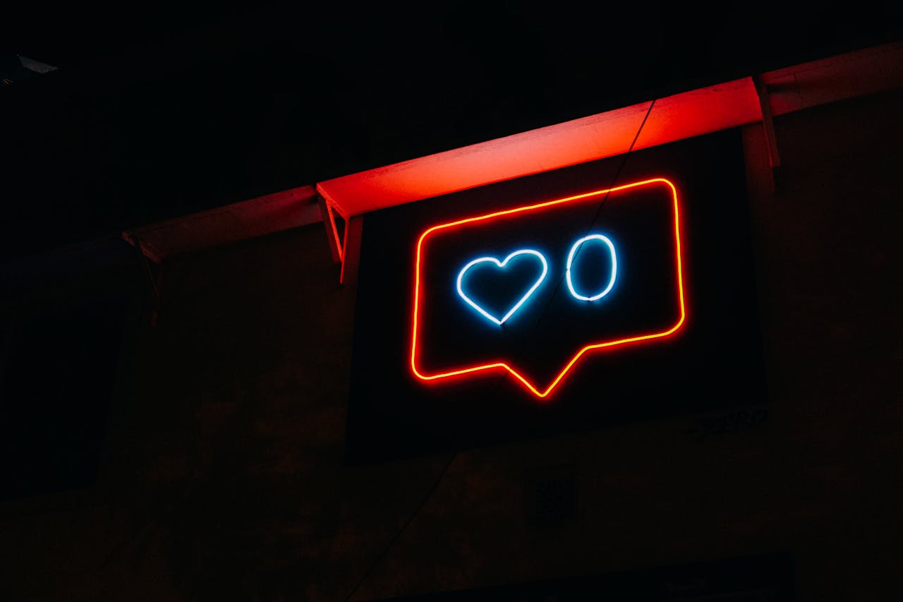 A neon sign that shows zero likes on a post - something that might happen without effective social media management!