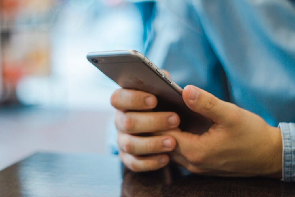 Man holding an Apple phone
