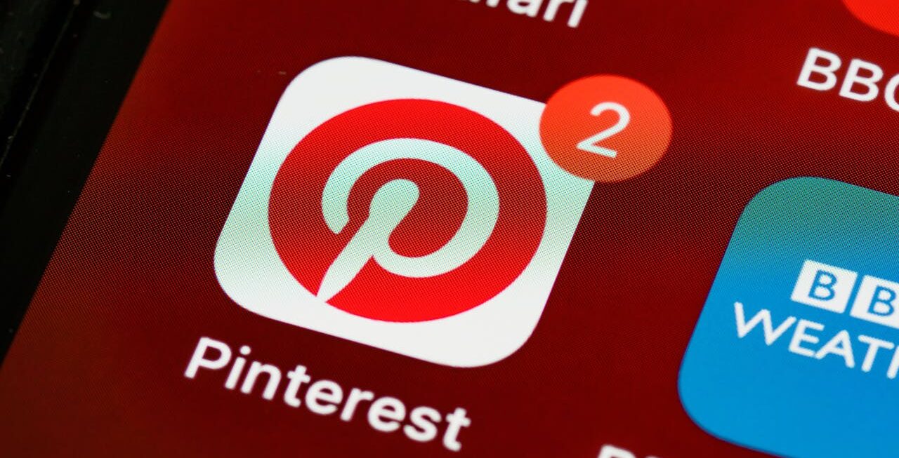 A pinterest icon on a smartphone with 2 notifications | Social media marketing in Surrey