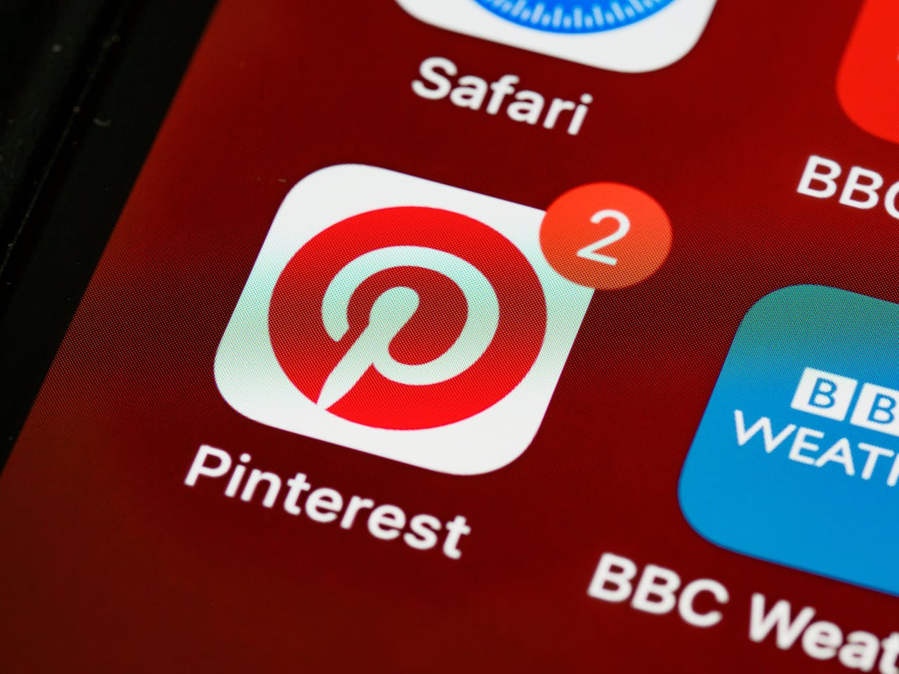 A pinterest icon on a smartphone with 2 notifications | Social media marketing in Surrey
