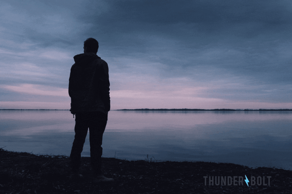 The silhouette of a man staring across a placid lake, with the title "Can Increasing Your SEO ROAS Be This Simple?"