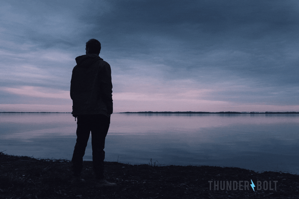 The silhouette of a man staring across a placid lake, with the title "Can Increasing Your SEO ROAS Be This Simple?"