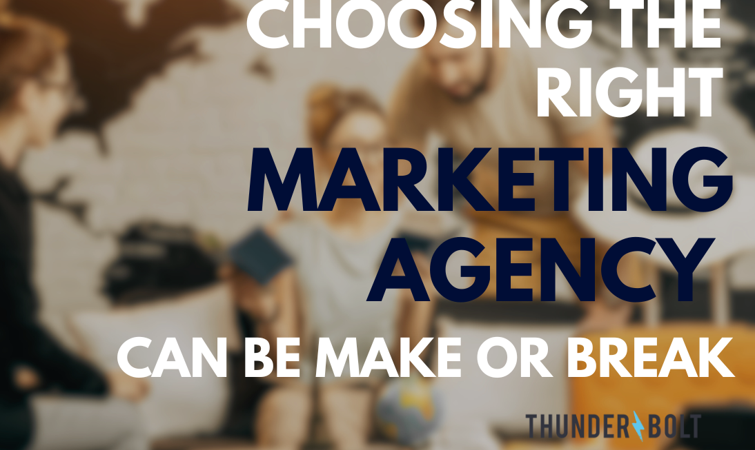 A blurry background of team members working at a Surrey marketing agency, overlaid with the title "Choosing the right marketing agency can be make or break"