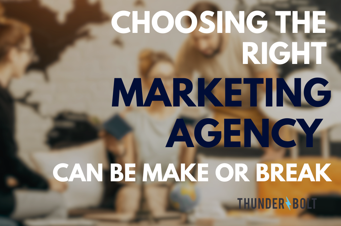 A blurry background of team members working at a Surrey marketing agency, overlaid with the title "Choosing the right marketing agency can be make or break"