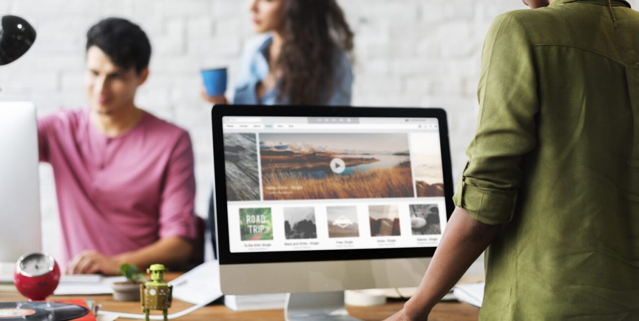 web designer working on screen to create a website